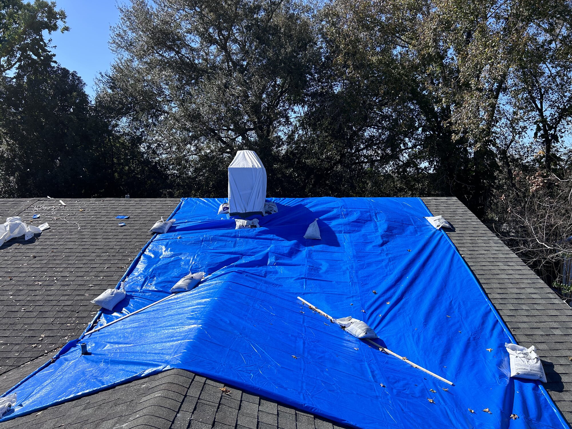 Professional roof tarping - insurance claims documentation for adjusters