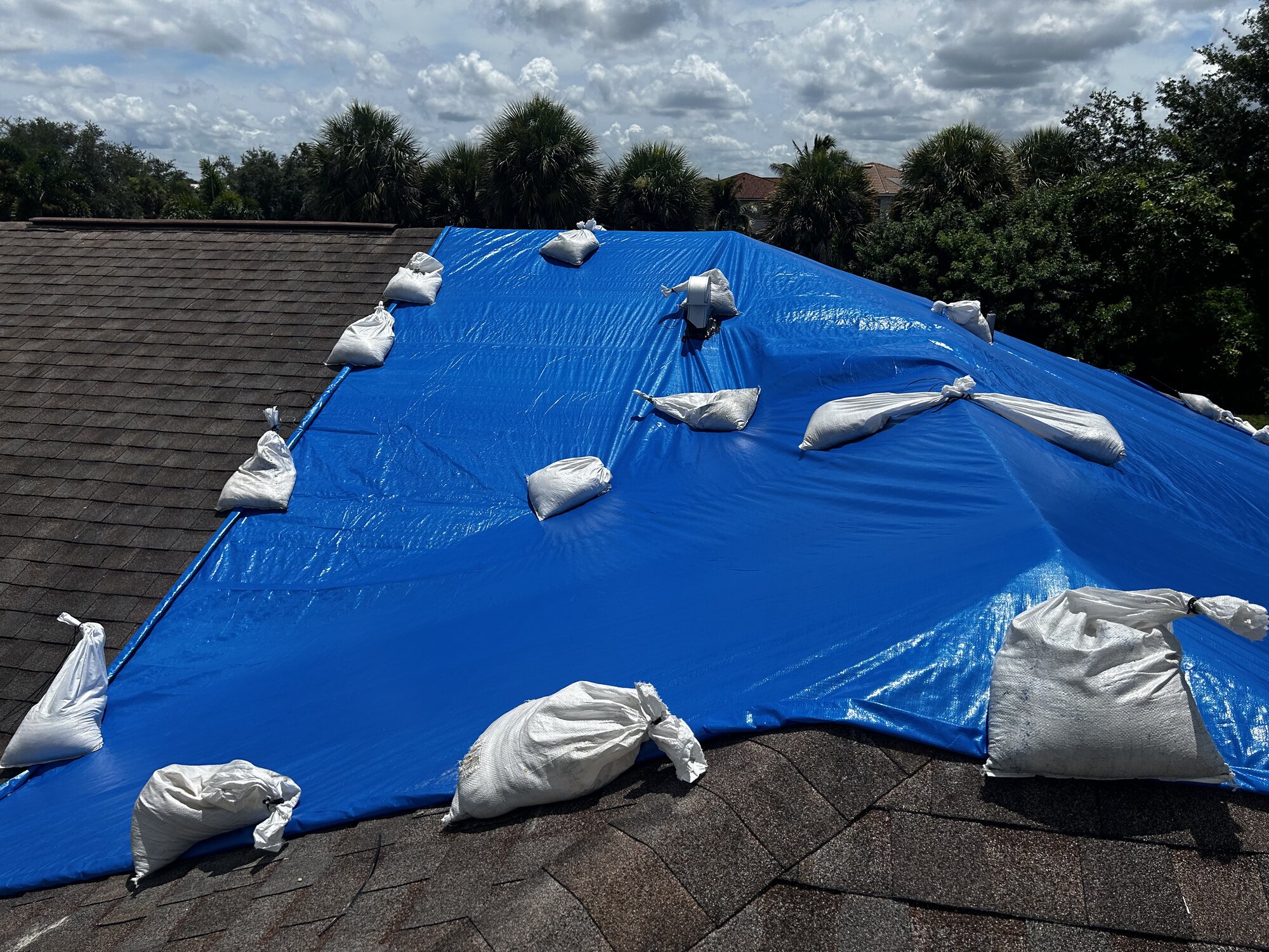 Storm damage mitigation - professional tarping installation photos