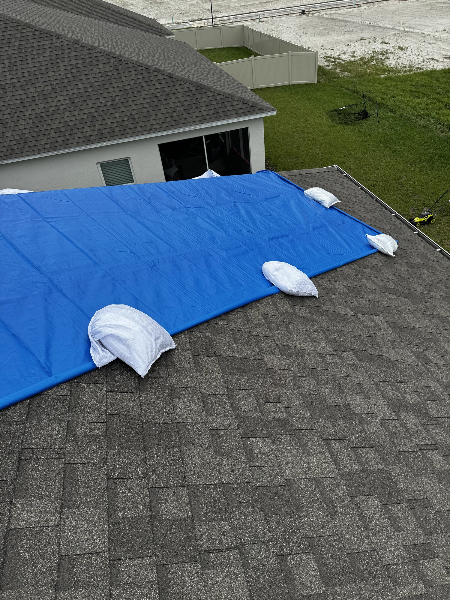 Emergency storm mitigation - professional tarping for insurance claims