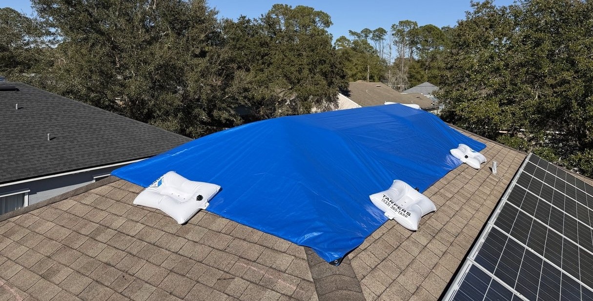TarpBags non-destructive roof tarping system in use
